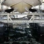 photo of one of LOTO Lift's rust-resistant boat lifts up close with boat on it