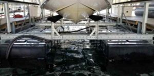 photo of one of LOTO Lift's rust-resistant boat lifts up close with boat on it