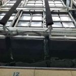 LT side-mount boat lift by LOTO Lift installed in a covered boat dock at Lake of the Ozarks.
